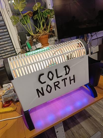 A space heater with LEDs. The front reads "Cold North" in uppercase.