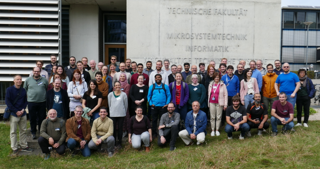 Group picture of participants in front of the department of computer science main building.