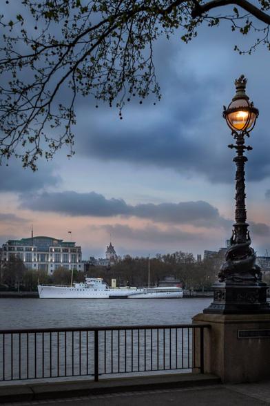 A boat by the river Thames. Skies and sunset.