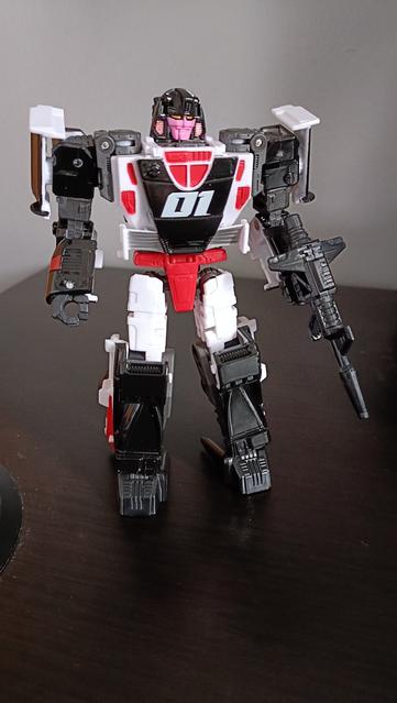 The Crasher toy back in May, unadorned. Flat colours and only  a 01 on her chest to provide a vague stab at detailing.