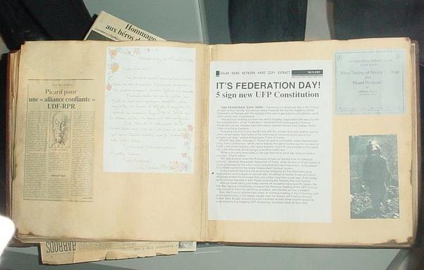 A photo album with an article “It’s Federation Day!” pasted on one side