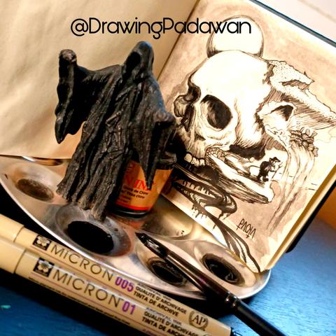 Escena de trabajo con la ilustración terminada y material alrededor