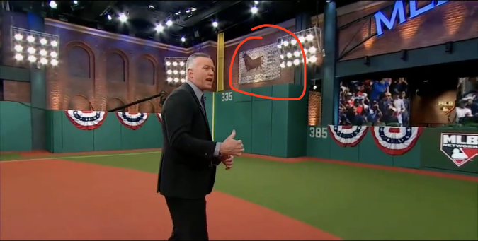 Screenshot of an MLB Networks playoffs post-game show. The set has a replica of the #DurhamBulls "Hit bull, win steak. Hit grass, win salad" sign.