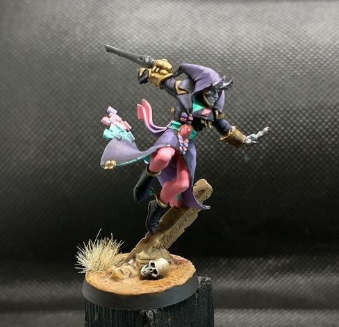 A harlequin solitaire miniature from the front
