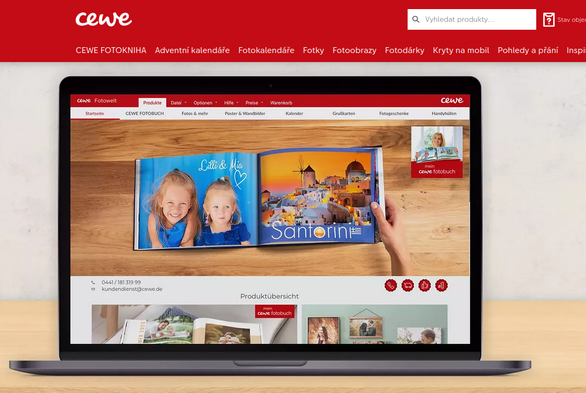 A screenshot of the Cewe website with a picture of a laptop running their desktop app.