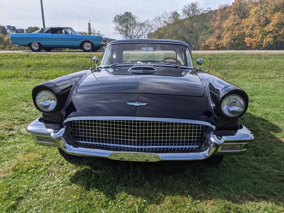 Photo of the front of the old black Ford Thunderbird car.