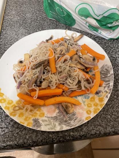 Stir fry noodes with mushrooms, carrots, and red onion. No soy sauce as I forgot to buy it on the way home.