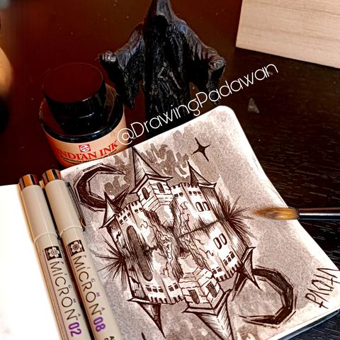 Escena de trabajo con la ilustración terminada y material alrededor de la mesa.