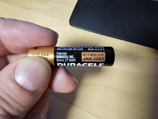 A Duracell AAA battery with a label that reads:

BEST INSTALLED BY
JAN 2002
