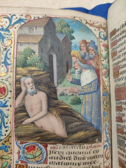 Job, naked, in a surprisingly shiny pile of dung, with people shaking fingers at him