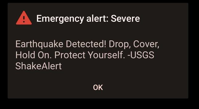 Emergency alert on my phone reading
"Earthquake Detected!
Drop, Cover, Hold On. Protect Yourself. -USGS ShakeAlert"