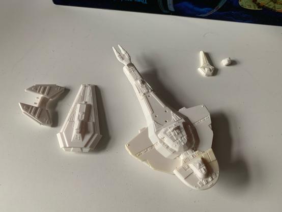 White plastic parts to build either a Galor or Keldon class Cardassian warship