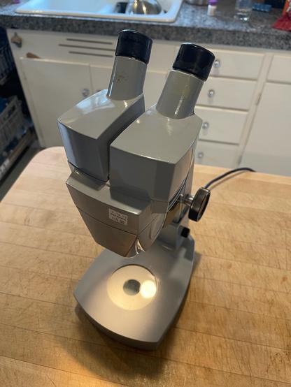 Front view of stereo microscope and showing top only illumination