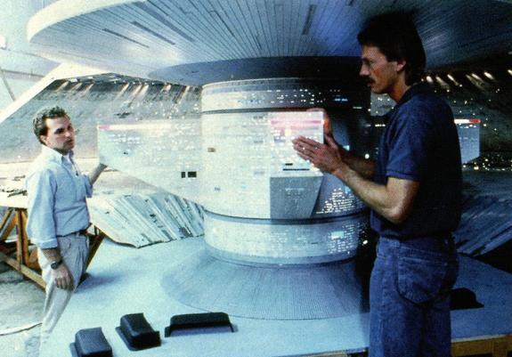 Two artists in the impressive spacedock model.