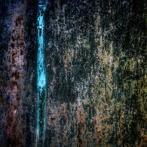 Abstract of a rusty panel at the bishop's palace Wells heavily edited for colour