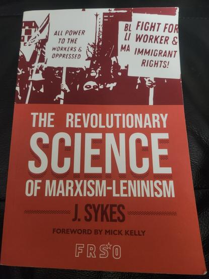 The cover of the book "The Revolutionary Science of Marxism-Leninism" by J. Sykes. The cover consists of a dark red, brighter red, and white and depicts a demonstration demanding "All power to the workers & oppressed" and "Fight for Worker & immigrant rights!"