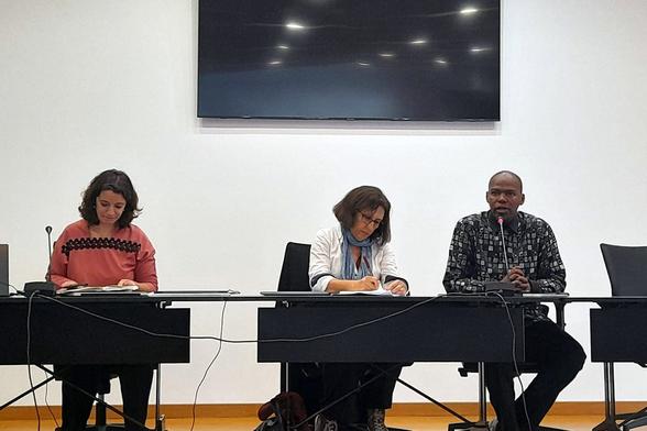 Cláudia Ninhos, Aida Rechena, and Luvuyo Ndzuzo sitting on the stage during the session dedicated to the Robben Island Museum.