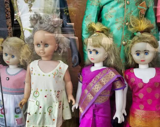 Creepy chidren mannequins on display in a shop window in Chennai, India.