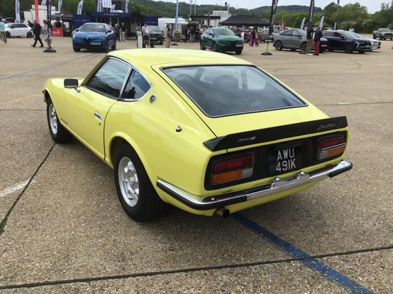 Yellow Nissan 240Z, rear quarter view