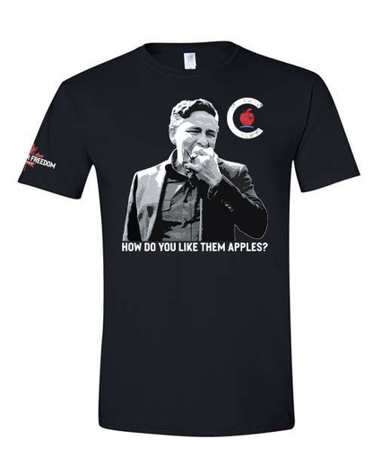 black t-shirt with image of Poilievre eating an apple.