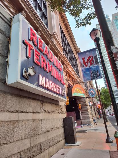 Neon sign that says Reading Terminal Market, corner of 12th and Filbert streets