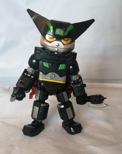 A mainly black robot with silver accents. It has a large head with horns, two axes, and eyes that suggest impending violence.