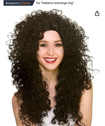 Woman in a long black curly costume wig.