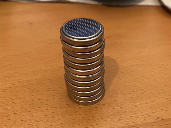 A stack of empty CR2032 batteries