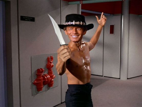 A mash up of Sulu from “The Naked Time,” when he was running around the Enterprise shirtless and waving a épée or something, and Crocodile Dundee from the first movie when he was instructing some kids just having fun as to what a proper knife looked like. 

So. Sulu’s body, Dundee’s head, holding a big knife.