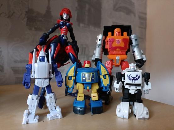 Bad Boy, Pathfinder are joined by Hasbro's release of Road Ranger (in the eHobby colours, no less). Unfortunately not to scale as he's twice the size of the others but it still kinda works.

Also joining them is the very special Universe Blackarachnia repaint, Crystal Widow! In the Fun Publications prose story, Withered Hope, the Gobots turned to her for help, eventually waking her out of her despair at being trapped in the city of Axiom Nexus an entire universe away from her lover, Skyjack.