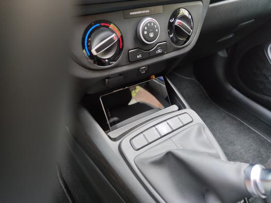 A photo from inside my car, showing a smartphone in the smartphone stand.
