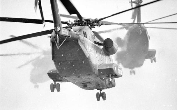 Some transport choppers taking off.
