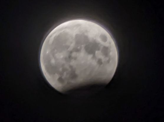 close up of moon, partially in shadow of the earth