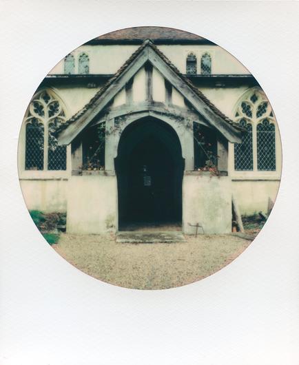 Colour polaroid of a church entrace porch and door