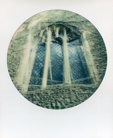 Colour polaroid multiple exposure of church tower window