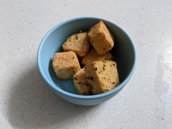 what appears to be tofu in a blue bowl