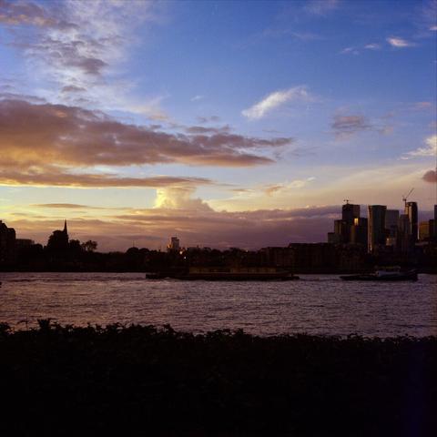 A scenic photograph across the Thames towards the city of London