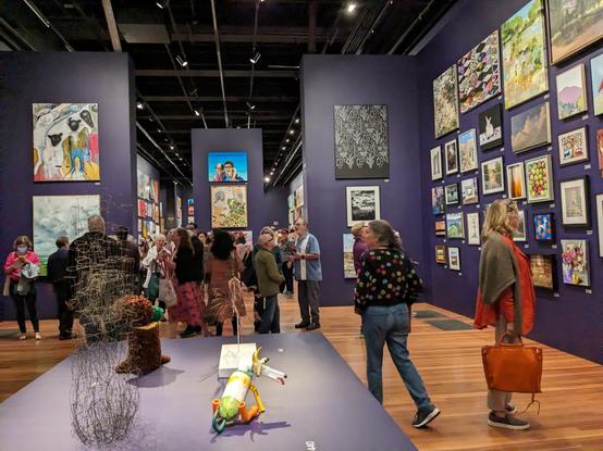 Artists view their work at the salon-style de Young Open 2023.