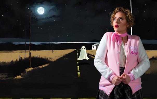 A school girl with a pink ascot pulls her jacket tightly around her as she stands on a lonely road at night. In the distance, a cartoon-y ghost bobs above the road.