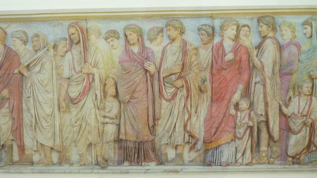 colourised frieze on the Altar of Peace, it shows a procession of people heading to the dedication of the altar.