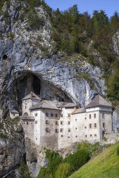 Famous Predjama Castle in Slovenia, set half way up a 400' cliff at the mouth of a cave.