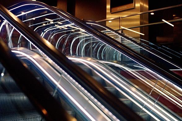 A row of escalators in a shopping mall in Canary Wharf