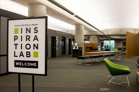 The sign in the foreground says "Vancouver Public Library, Inspiration Lab, Welcome" and in the background you see the recording studios, the presentation space and our computer gallery.