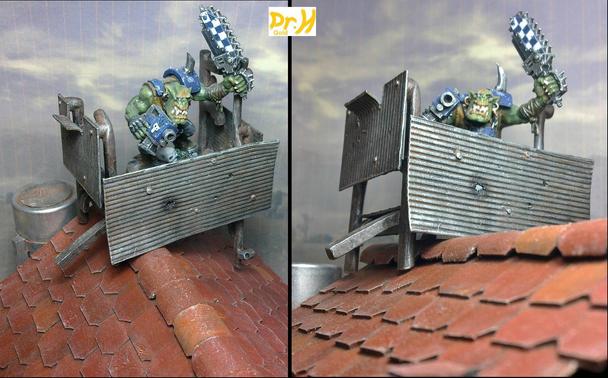 Ork miniature on the rooftop lookout.