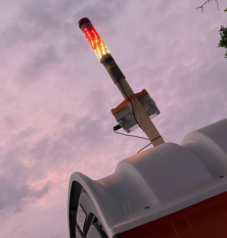 Photo of the flame effect LED light atop a Datenklo (data toilet) at EMF 2022. The wifi is strong in this one...