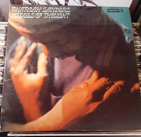 Album cover features a photograph of Pharoah Sanders, head bowed, arms folded across his chest.