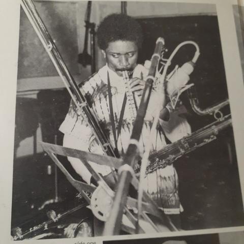 Photo from inside of gatefold sleeve shows Pharoah playing... a piccolo? in the studio, with a contrabass clarinet hanging from his neck.