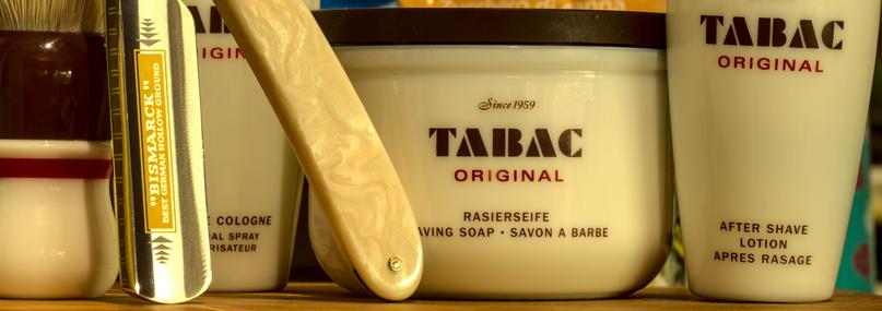 A Stank Tank® with matching splash, cologne, and brush and a Dovo Bismarck 2