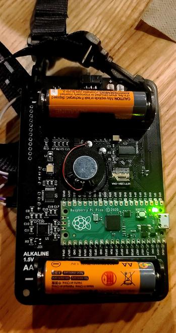 Back of badge revealing Raspberry Pi Pico.