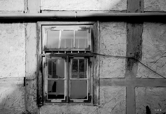 An old  window in a timber-framed house.